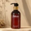 Gel douche Sokoune Vétiver d’Haïti, flacon pompe ambré 250 ml posé sur une pierre beige
