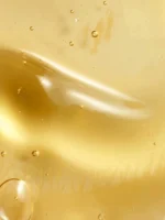 Texture dorée de l'huile de douche Sokoune